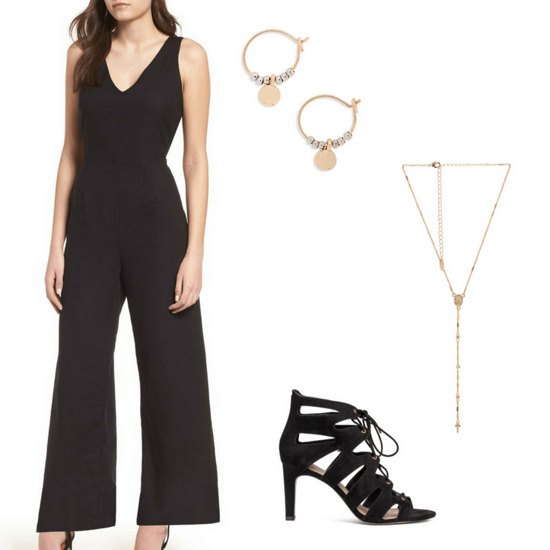 Graduation outfit idea with a jumpsuit: Black v-neck jumpsuit, black strappy heels, gold lariat necklace, gold and silver hoop earrings