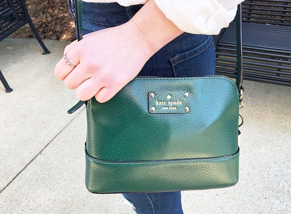 This emerald crossbody small Kate Spade purse adds a pop of color to this WVU fashionista's simple style.