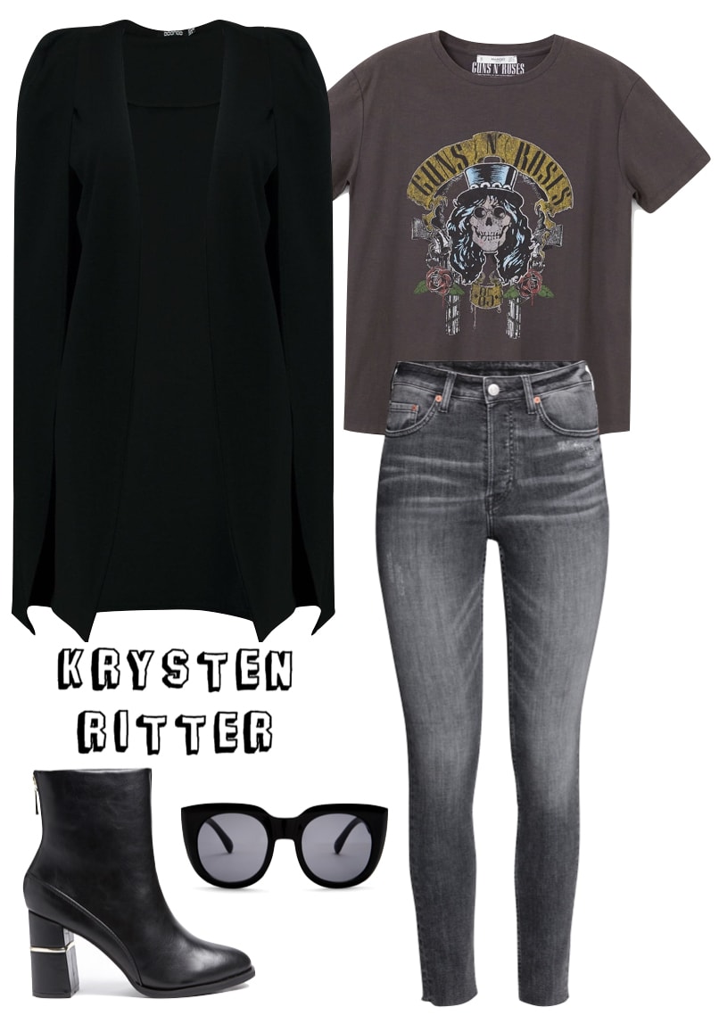 Krysten Ritter Outfit: black longline cape, gray rocker graphic t-shirt, gray jeans, black sunglasses, and black mid-calf booties