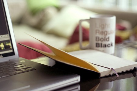 laptop-and-book-on-desk