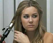 Lauren Conrad curling her hair with a curling iron