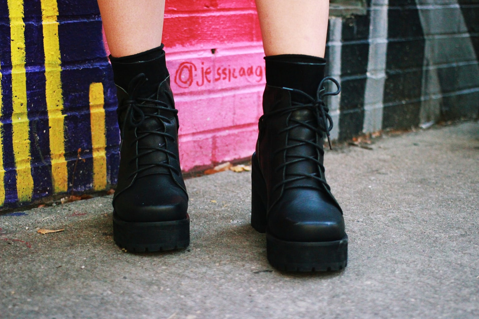 Chunky punk black lace-up boots add to this Fashion Institute of Technology student's overall attire.