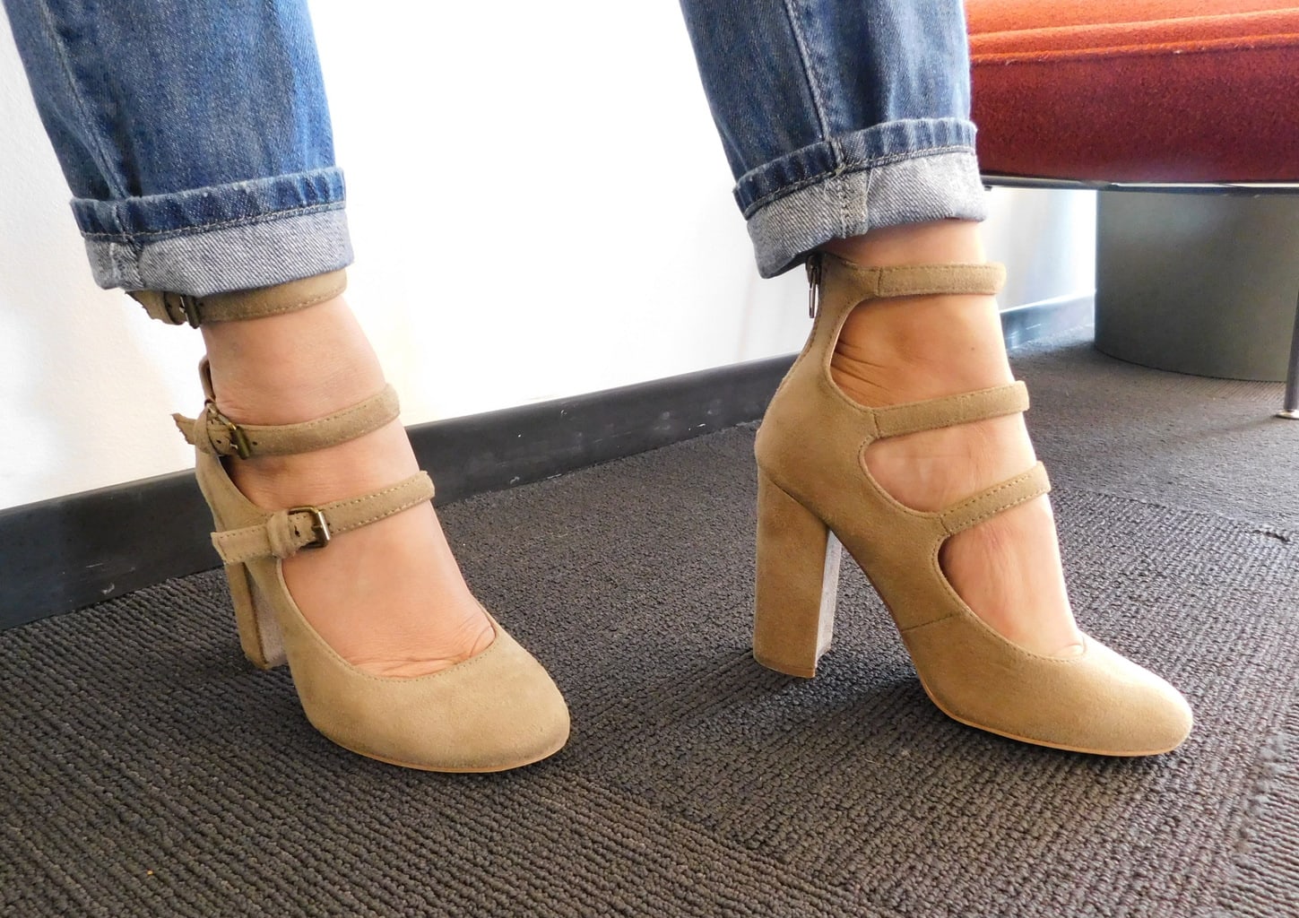 Lauren shows off her chunky-heeled mary jane inspired heels with three straps and silver buckles.