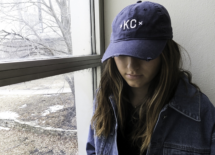 This soft blue KC hat is the perfect accessory for a Kansas girl having a messy hair day.