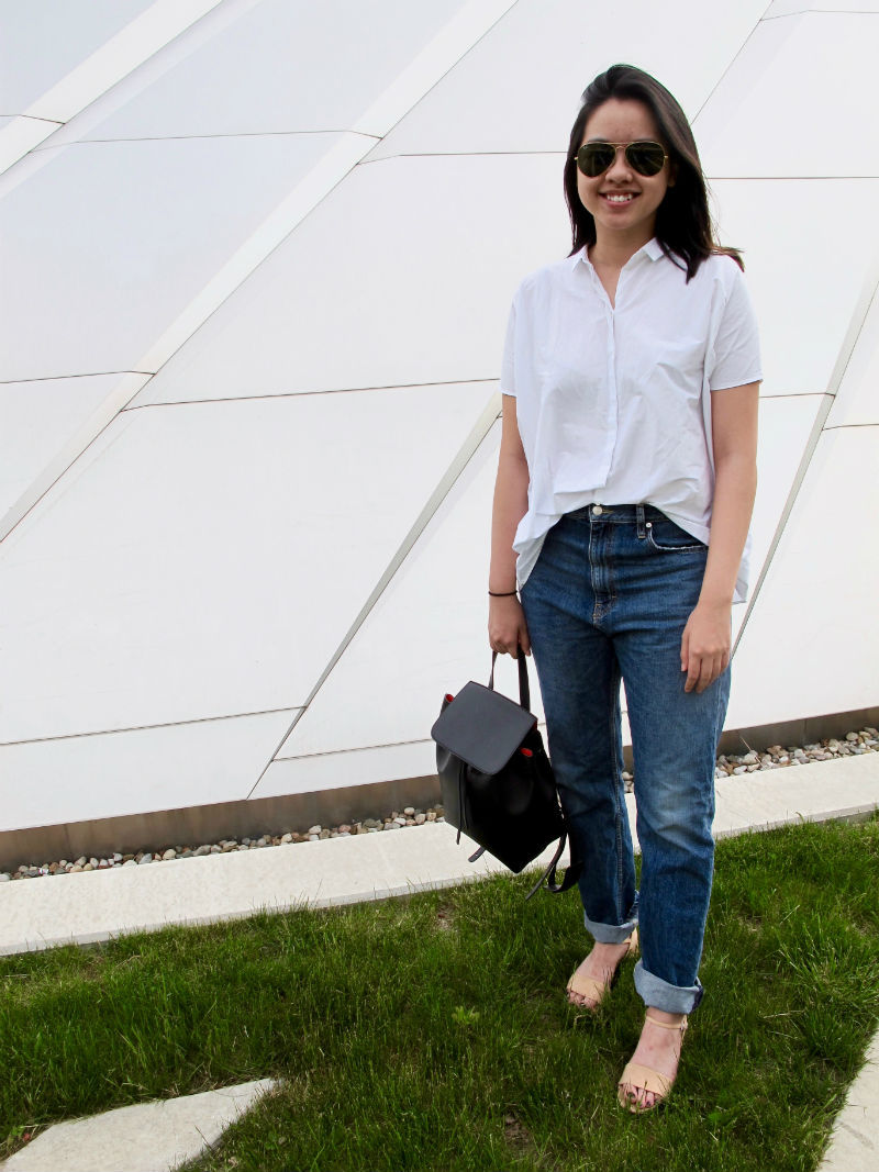 MSU fashion -- Student Julia wears boyfriend jeans, a white button down shirt, aviator sunglasses and strappy sandals, plus a minimalist black backpack