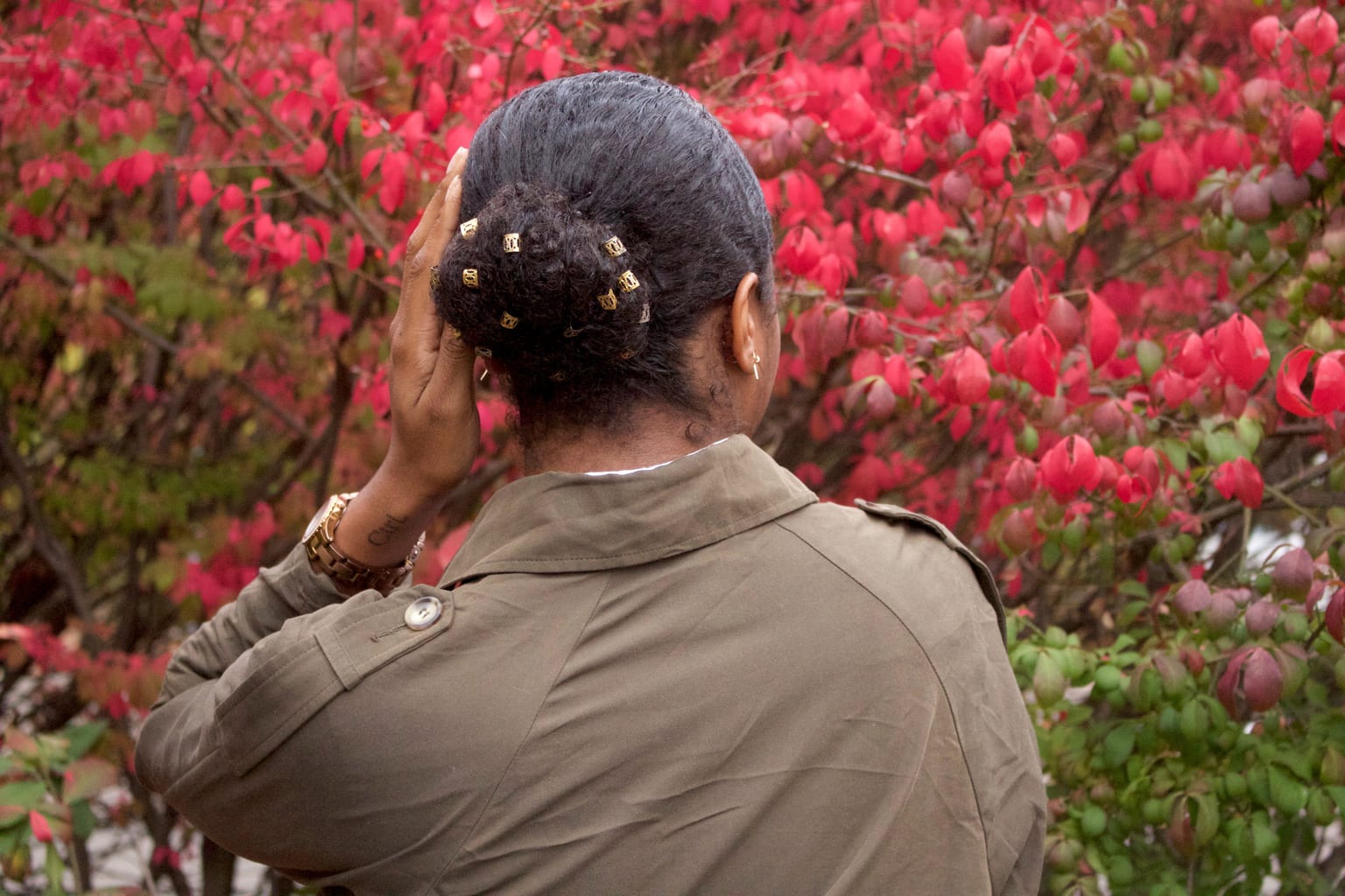 Southern Connecticut State University student wears gold hair clips in her bun.