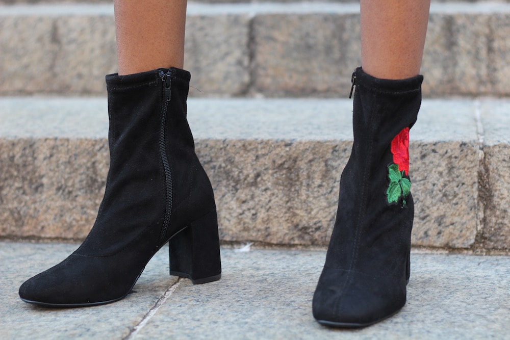 College fashion trends: Embroidered booties. College student fashionista from University of Missouri wears black suede booties embroidered with roses