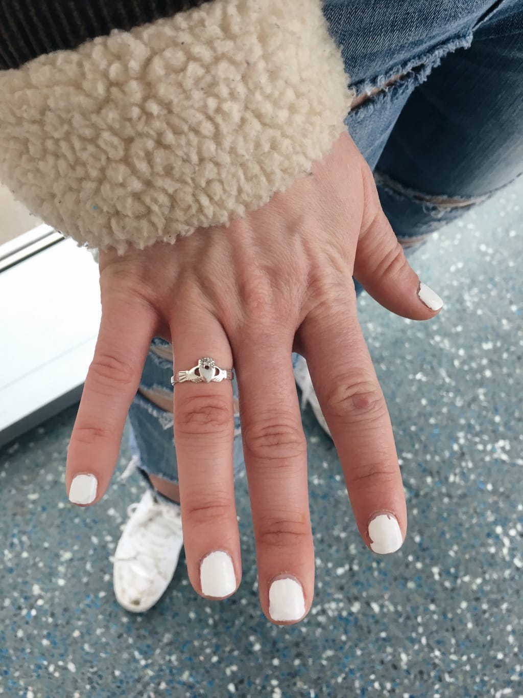 This dainty silver claddagh ring symbolizes Erin's relationship status.