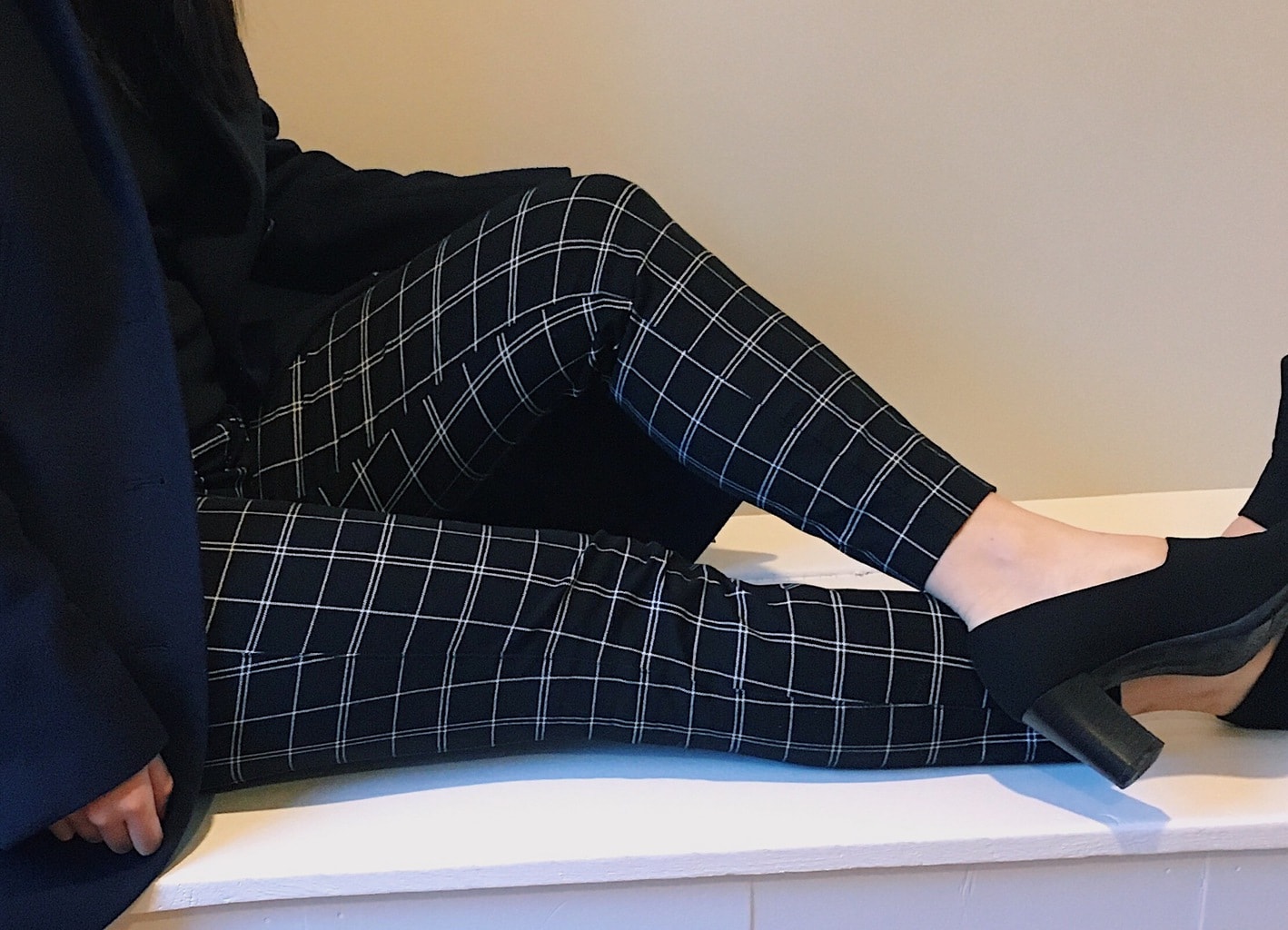 These black and white slim-fit pants are great for professional wear.