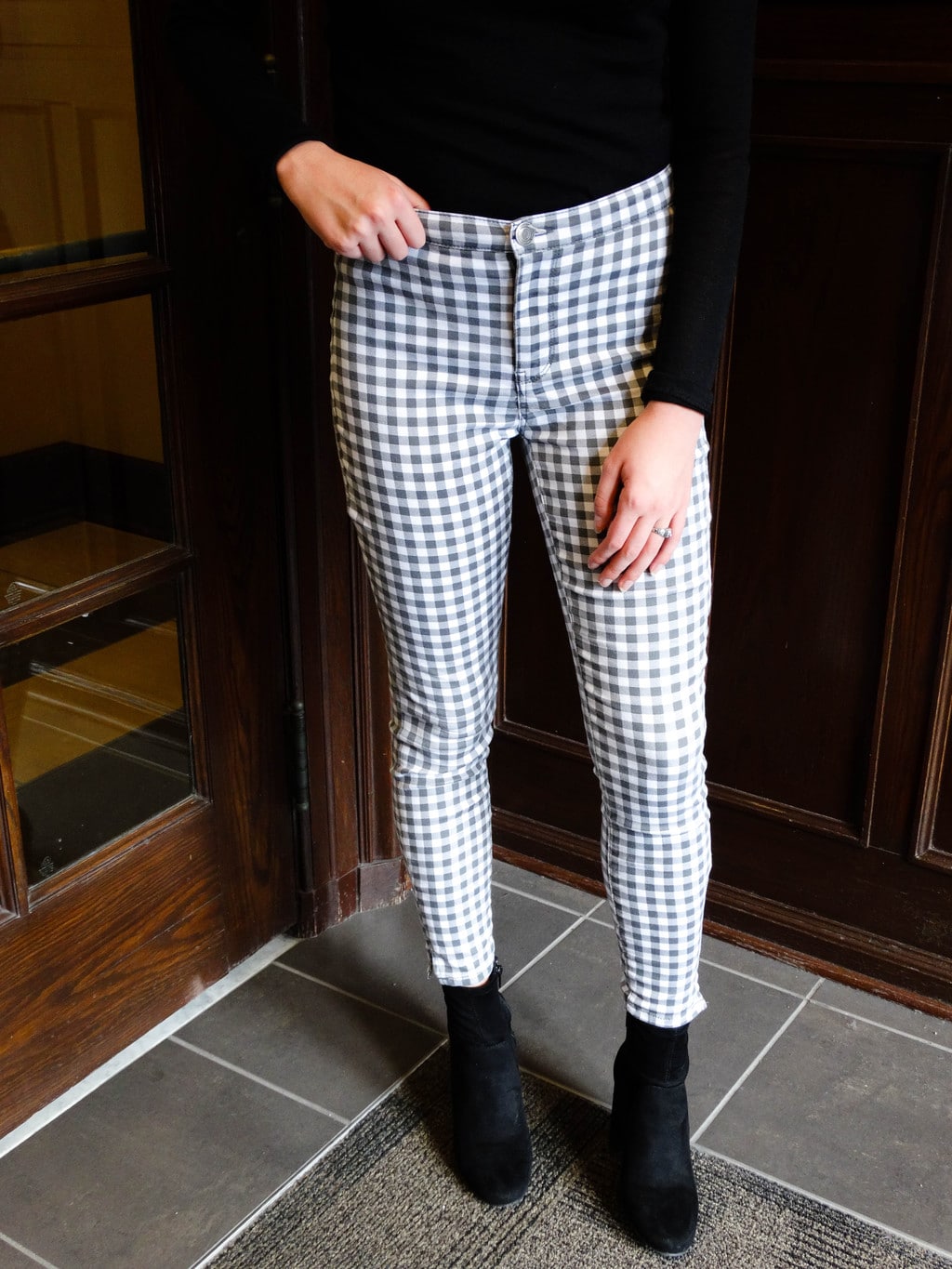 These form-hugging grey and white high-waisted checkered pants make a statement.