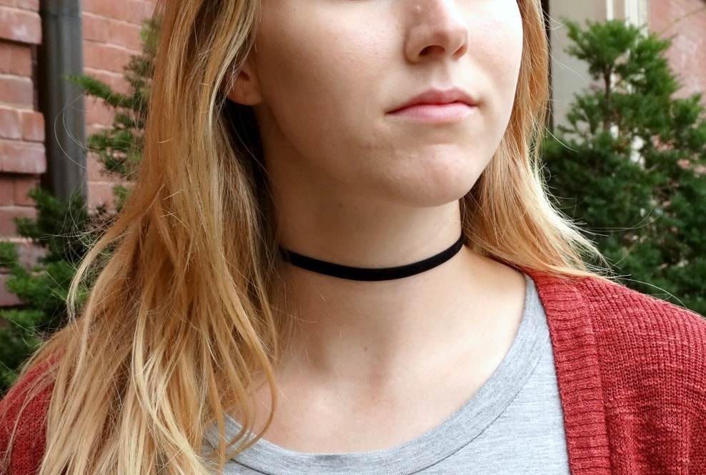 A simple black choker makes a big impact.