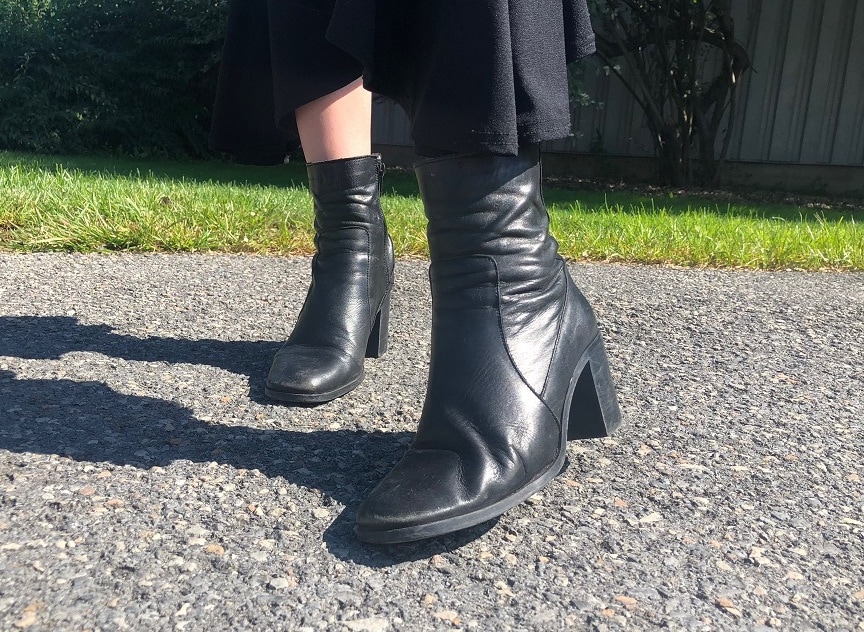 Georgia wears chunky black heeled ankle booties with side zippers and square toes.