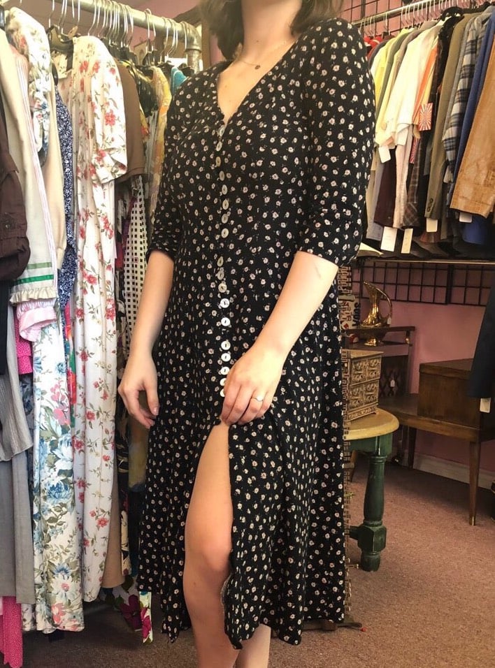 This West Virginia University student wears a vintage floral black button-down midi dress.