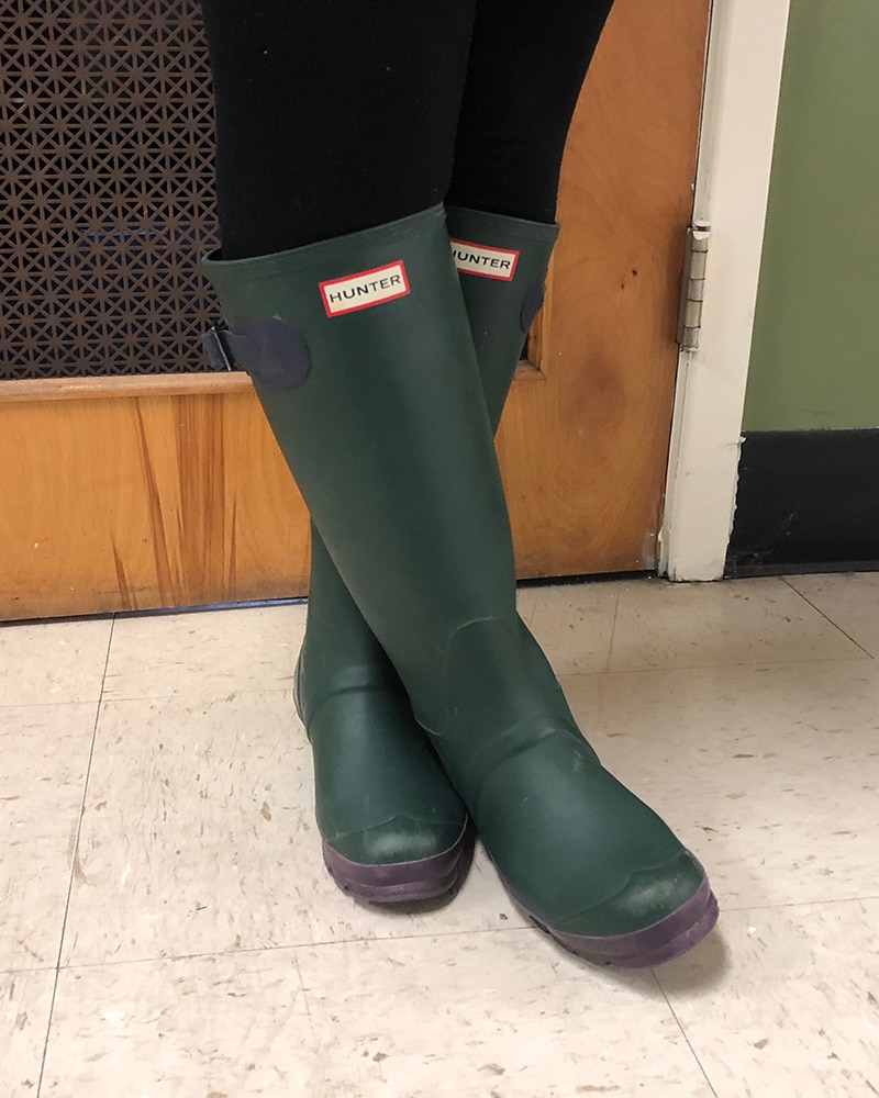 These original green rubber Hunter rain boots are an iconic footwear style.