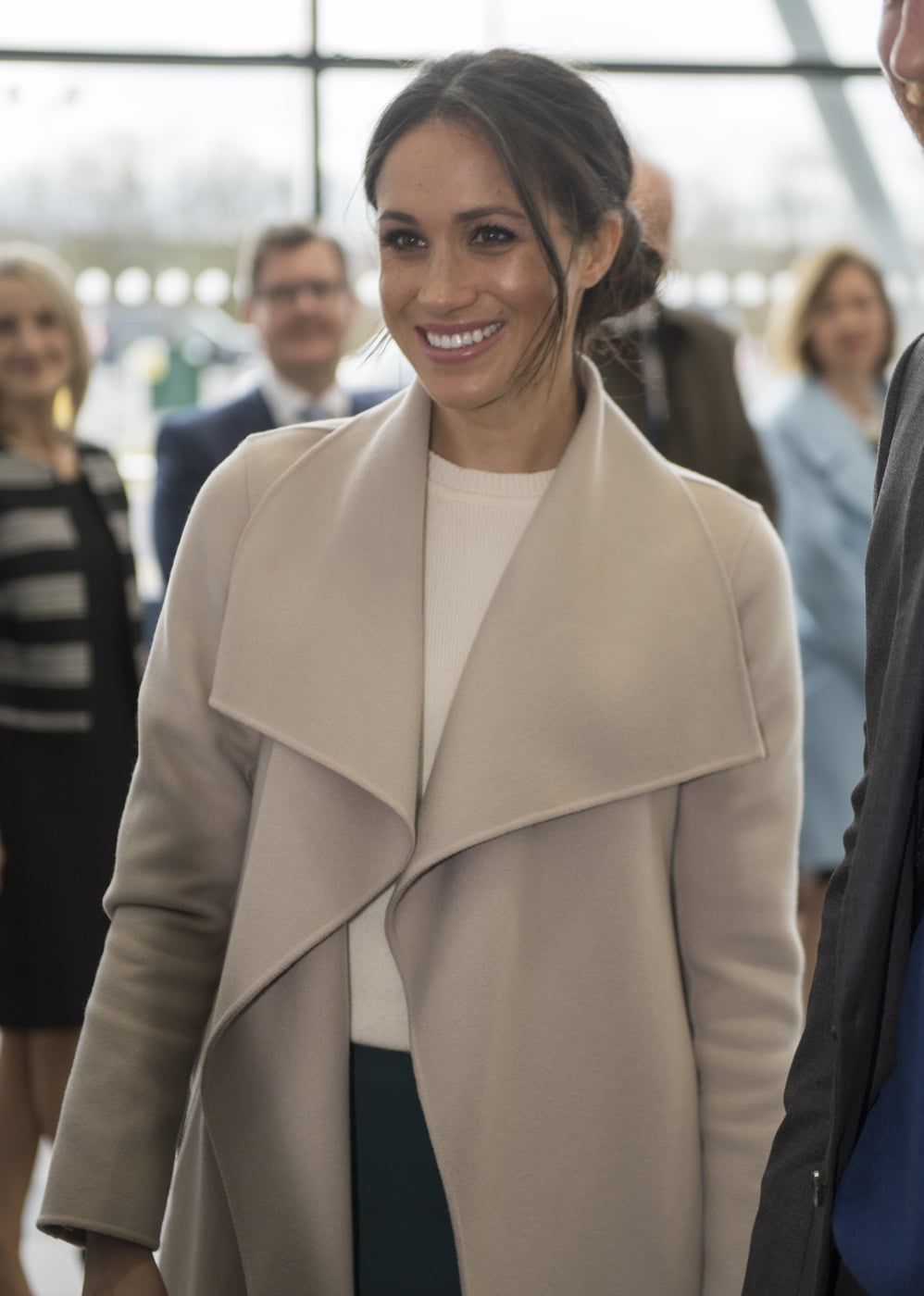 Meghan Markle wearing a nude coat and beige dress