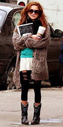 Mary Kate Olsen wearing cowboy boots and leggings