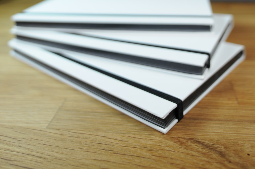 Stack of white notebooks