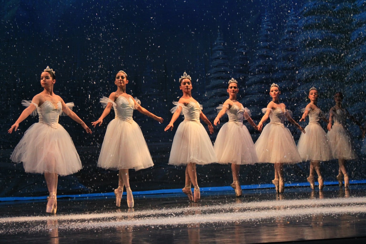 The Snowflakes dancing during the Nutcracker Ballet, with fake snow falling on them