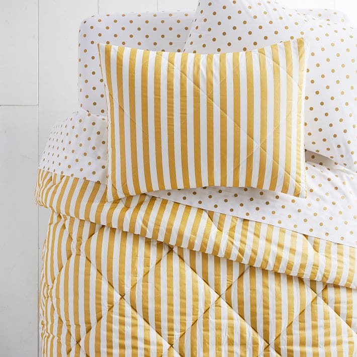 Bold yellow and white striped comforter and polka dot sham set from PB Teen.