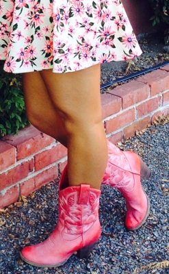 Pink cowgirl boots and floral skirt