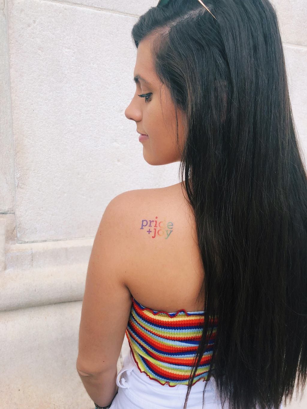 Girl with a Pride tattoo