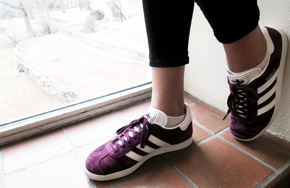 Purple adidas sneakers on campus at Kansas State University