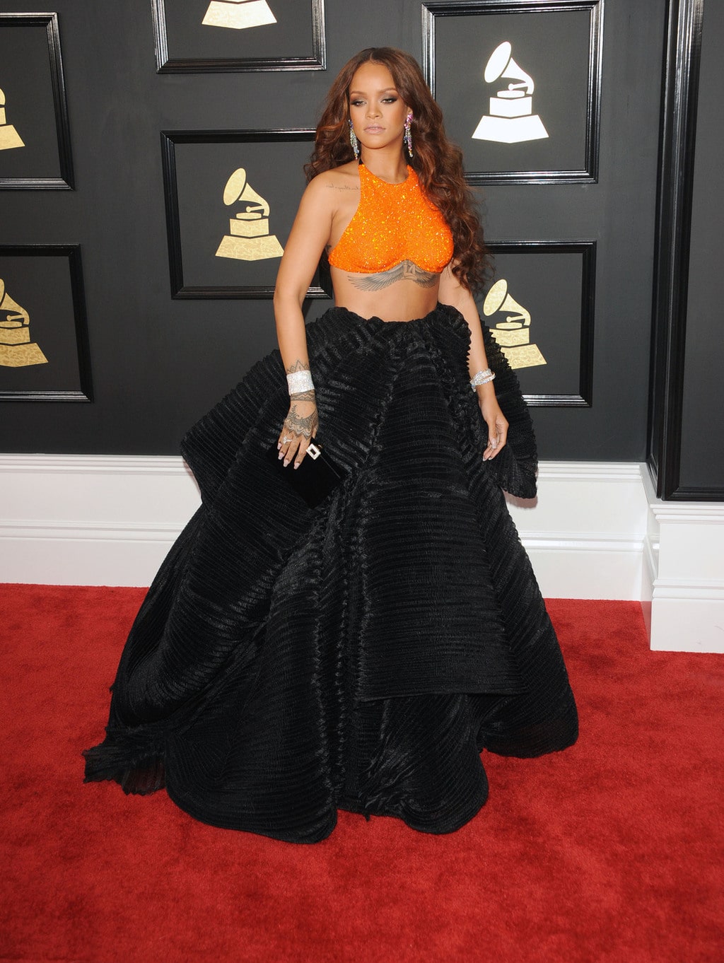 Rihanna in Armani Prive orange crop top and black skirt at the 2017 Grammy Awards