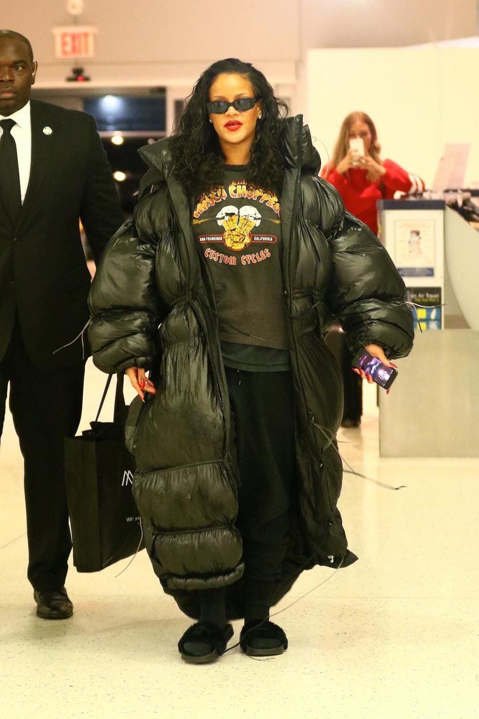 women fashion icons - Rihanna in an oversized full-length jacket.