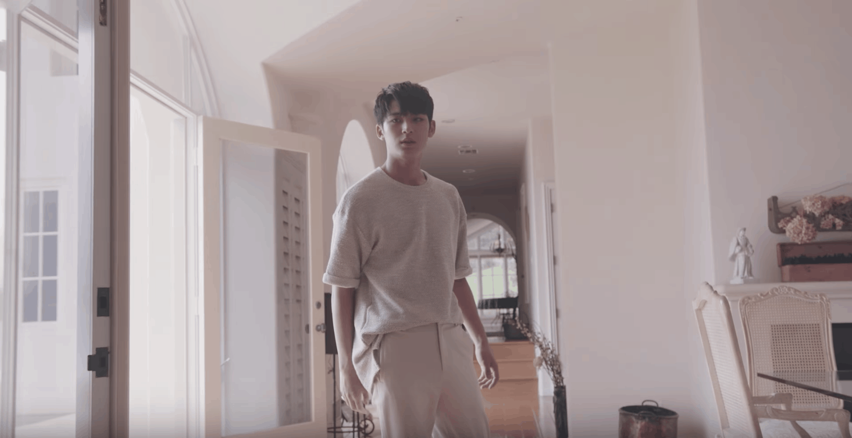 Seventeen kpop fashion: Don't Wanna Cry music video. Guy rocks neutral outfit with beige pants and off white tee shirt.