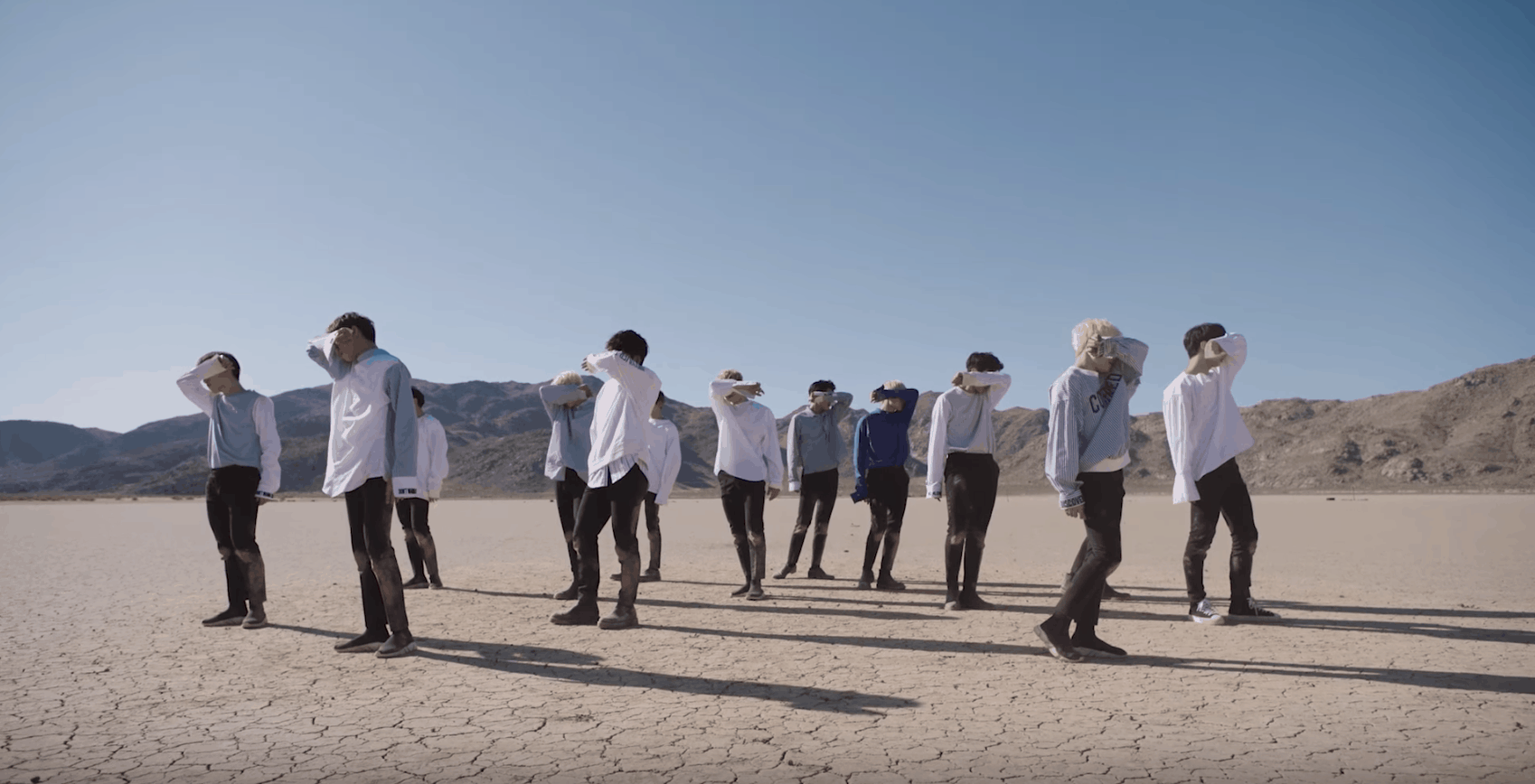 Seventeen kpop fashion: The members in the Don't Wanna Cry music video wearing white shirts and dark pants