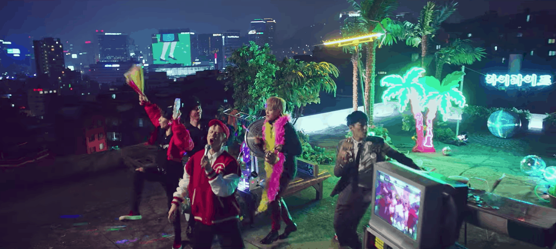 Highlight can be better music video fashion: The boys performing on a rooftop with palm trees