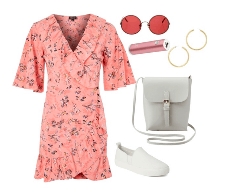 Coachella outfit idea: Floral dress paired with white slip on sneakers. Accessories include a crossbody bag, sunglasses, portable charger and hoop earrings.