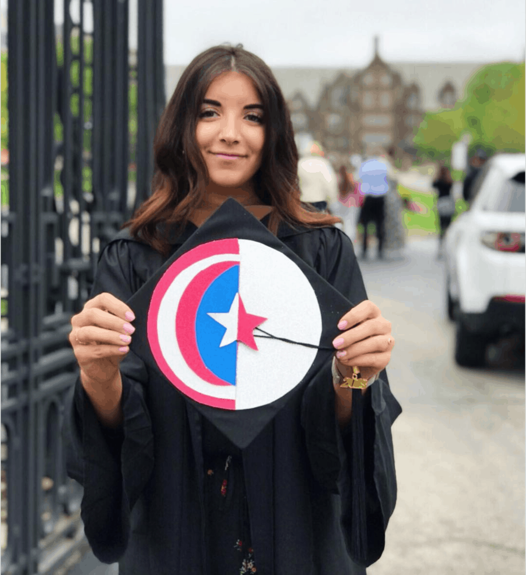 Girl holding graduation cap