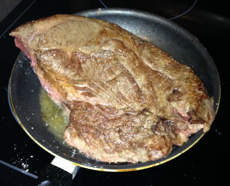 This is what your roast should look like when you flip it over after browning the first side. Color, and delicious brown bits on the meat and in the olive oil.