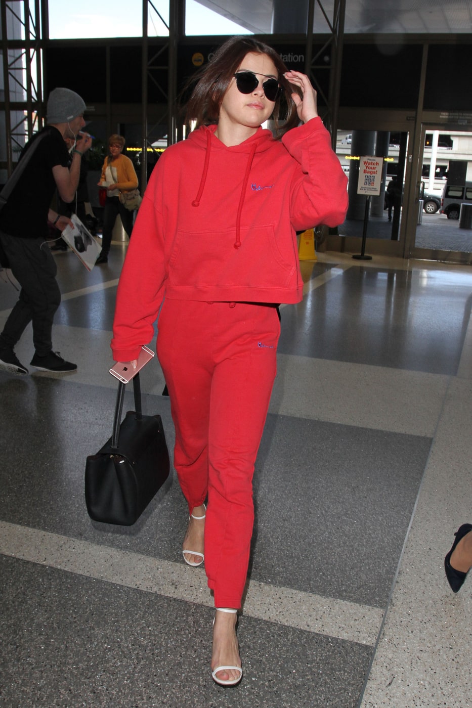 Selena Gomez in a red Vetements hoodie and jogger pants