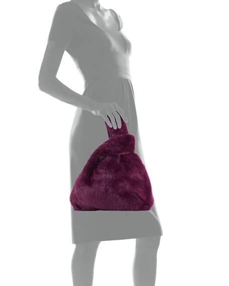 Model showing a Simonetta Ravizza fur bag