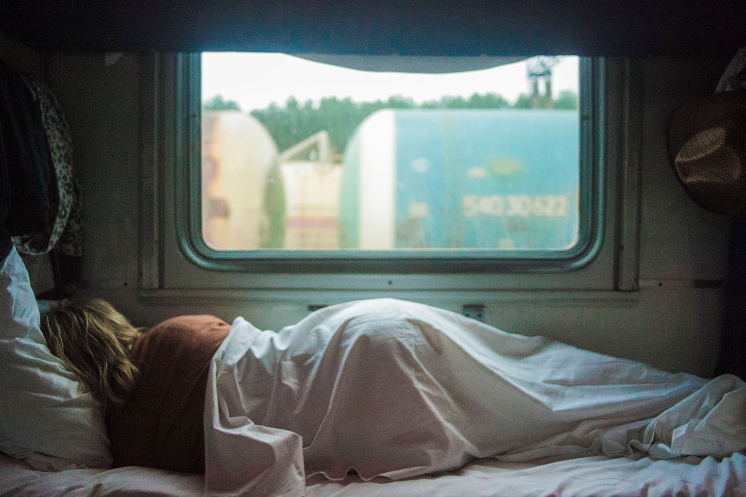 Girl sleeping by window