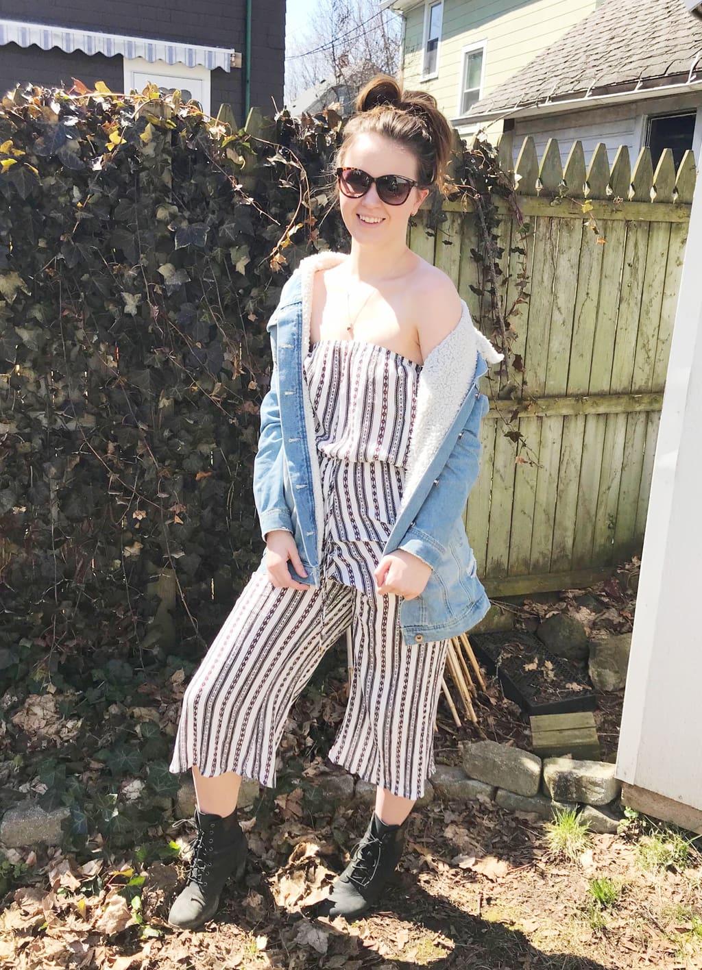 Jumpsuit outfit at mercyhurst university - patterned strapless jumpsuit, shearling denim jacket, high heeled timberland boots