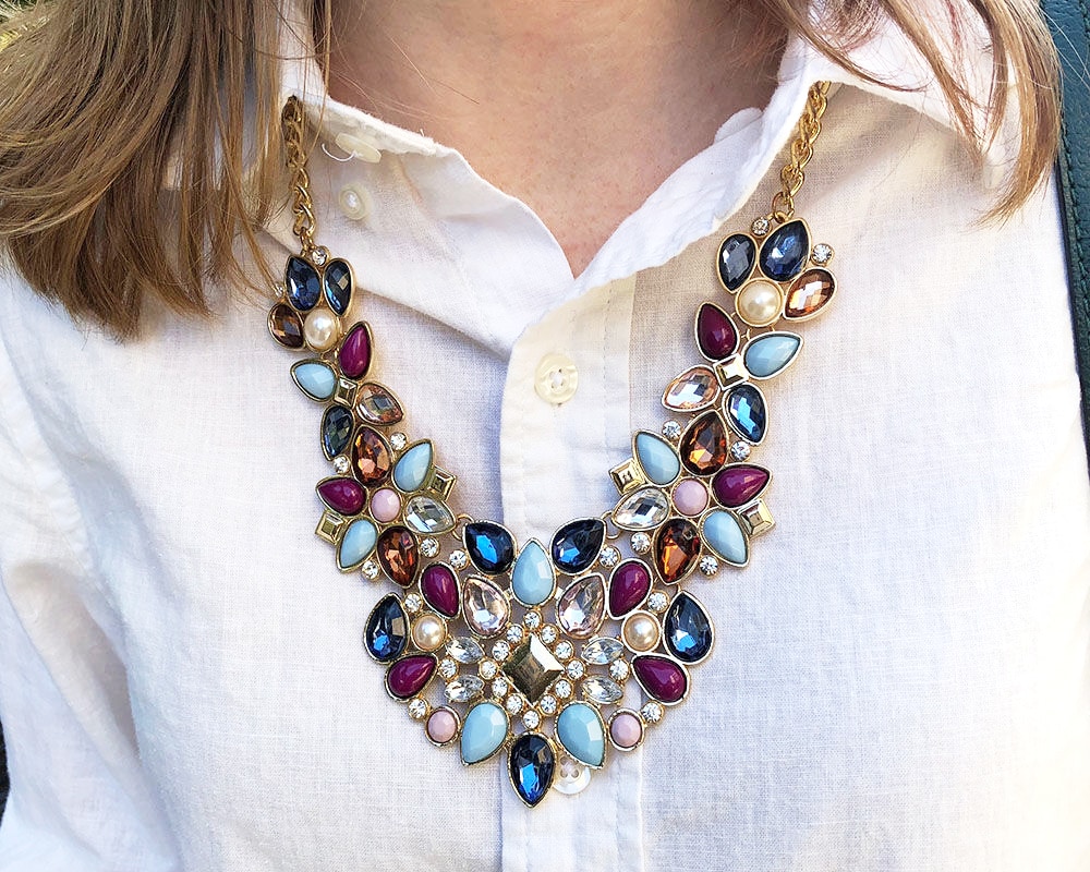 Jeweled statement necklace in blue, magenta, turquoise and clear on campus at WVU