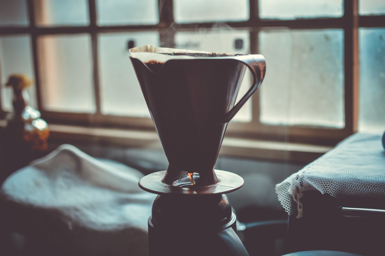 Stock photo of a coffee balanced on a bed post