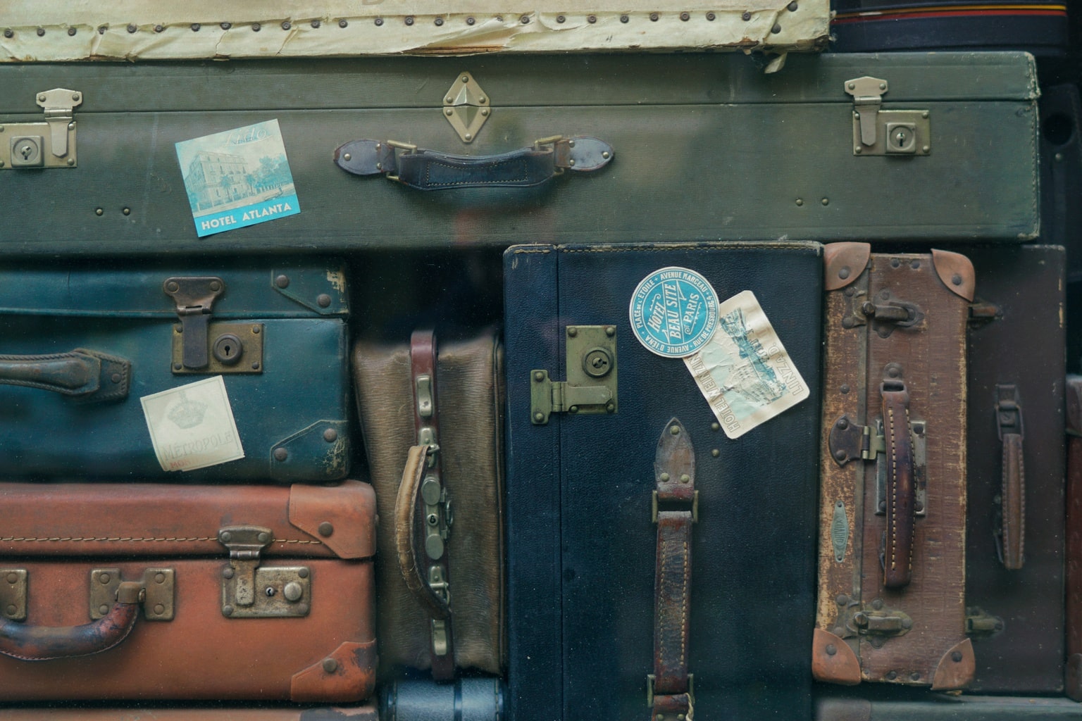 Stack of old fashioned luggage with passport stamps