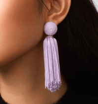 Photo of lilac tassel statement earrings.