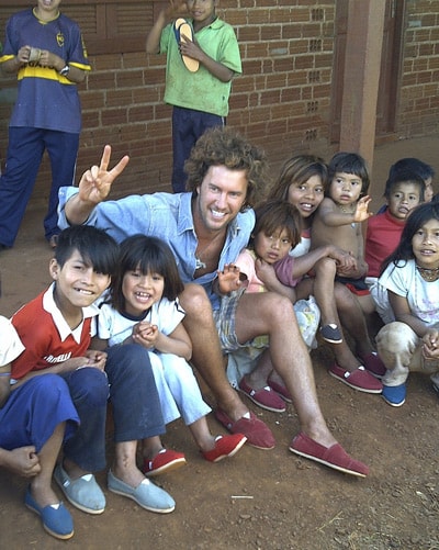 TOMS CEO Blake Mycoskie and children in Argentina