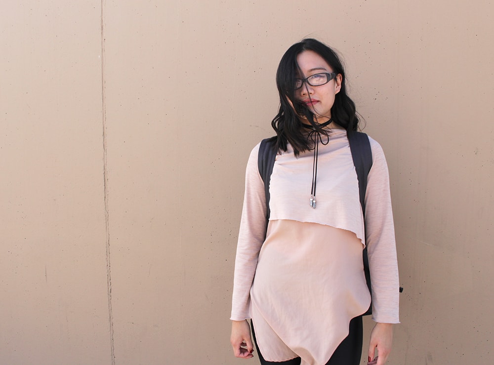 Pink layered asymmetrical top on campus at the University of Calgary