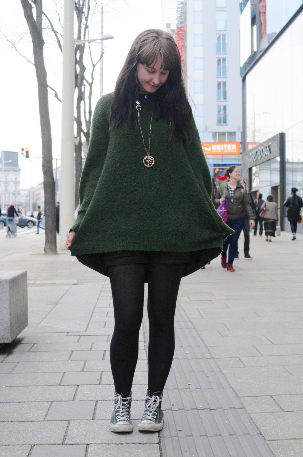 Fashion at the University of Vienna: Student Vroni wears an oversized sweater, tights, Converse, and statement jewelry