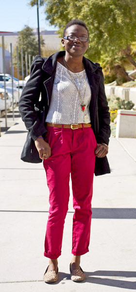 UNLV fashion - college student wearing red pants, lace top, black jacket, belt, cute necklace, leopard smoking slippers