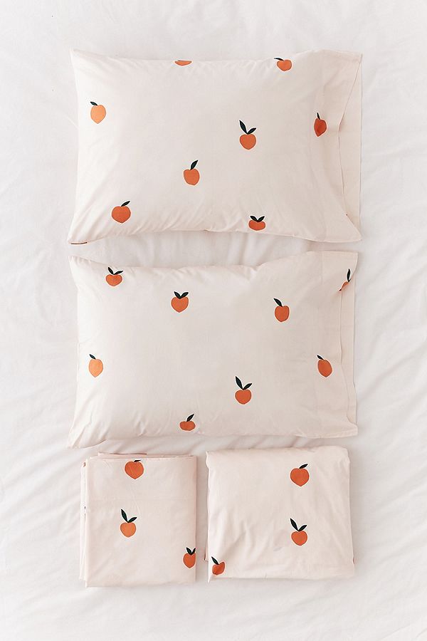 Urban Outfitter's cream peach-patterned sheet and sham set.