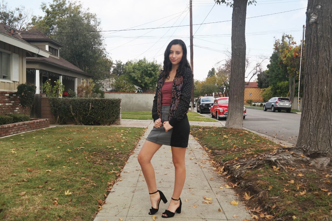 Warm weather fall outfit for a night out: Mini skirt, heels, bomber jacket, cute tank