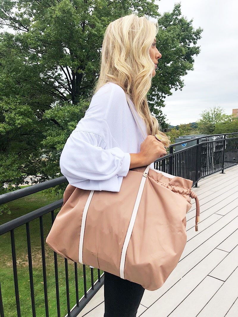 WVU student Gabriella's extra-large brown tote bag has contrasting cream straps.