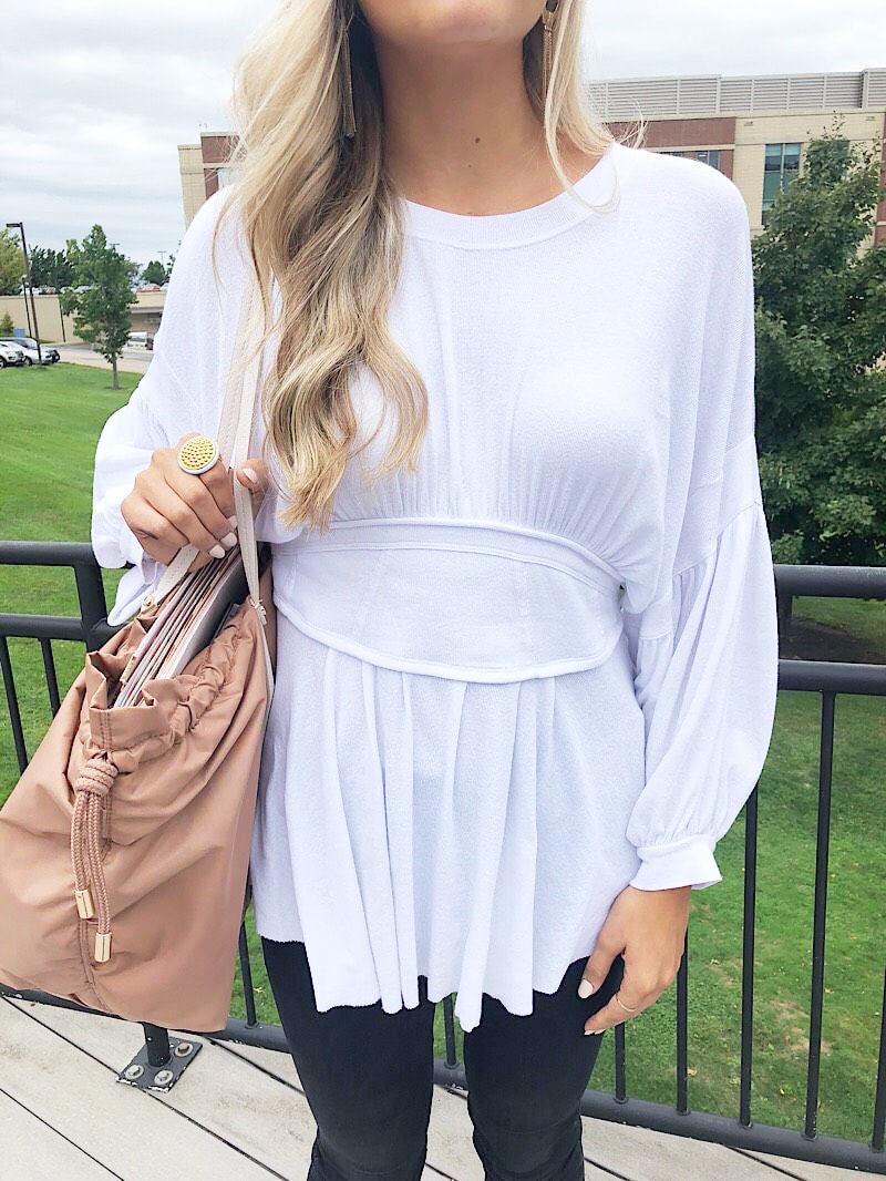 WVU student Gabriella wears a casual white tunic with bell sleeves.